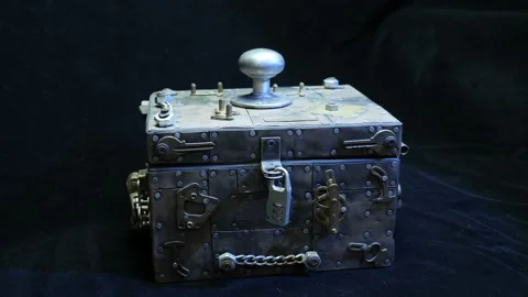 The hand removes the lock and opens, closes the lid box (safe) with metal trim  Stock Footage 121600723