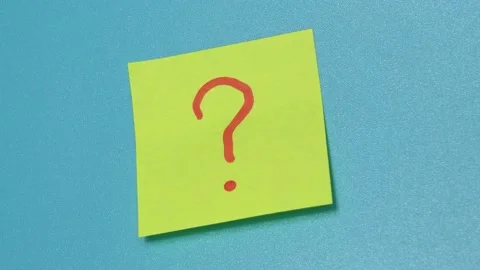 Hand removes sticker with question mark from blue wall Stock Footage 154762087