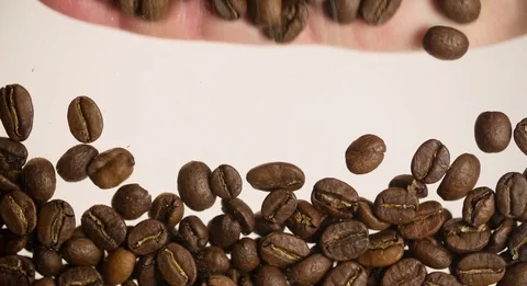 Hand removing coffee beans Coffee Background Slow motion bottom view Stock Footage 103642167