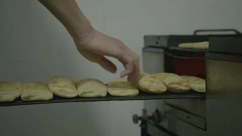 Hand Removing Fresh Flatbreads From Oven in Beijing Street Food Kitchen Stock Footage 345856035