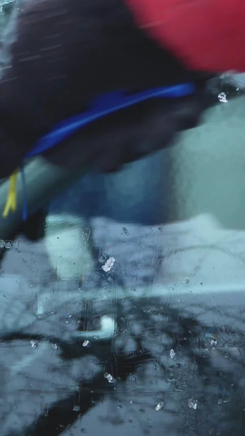 Hand Removing Ice from Car Window in Winter Stock Footage 346525934