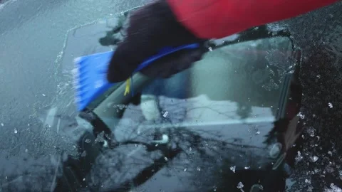 Hand Removing Ice from Car Window in Winter Stock Footage 346526200