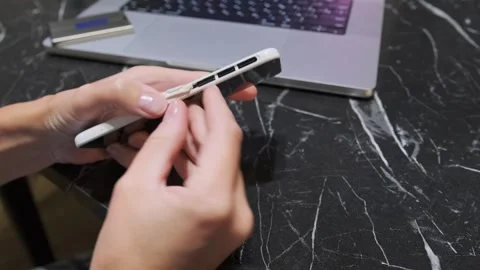 Hand removing micro SD memory card from smartphone slot, close-up of mobile Stock Footage 333649702