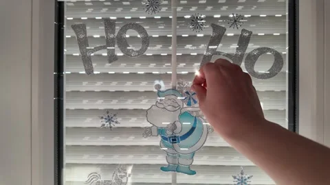 A hand removing New Year decorations. Stock Footage 317630063