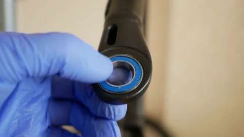 Hand of the repairman in blue glove Stock Footage 147455553