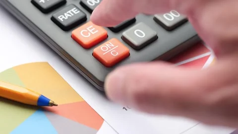 A hand repeatedly pressing the orange ON/C reset button. Stock Footage 343300400