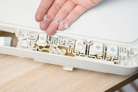 Hand Replacing Control Buttons Inside White Printer With Exposed Circuit Bo.. Stock Photos