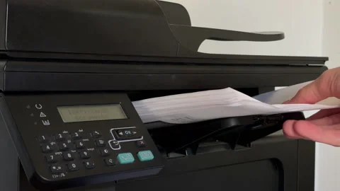 Hand Retrieving Paper Sheet from Printer - Close Up - 4K Stock Footage 161973314
