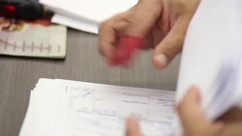Hand reviewing documents Stock Footage 77046648