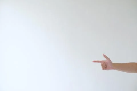 A hand on the right side is pointing to the left sideadvice, aim, arrow, as.. Stock Photos