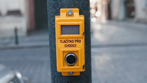 Hand ring presses traffic light button. Regulation movement pedestrians and cars Stock Footage 136233138