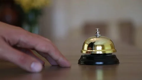 Hand Ringing Service Bell on Hotel Reception Stock Footage 339702985