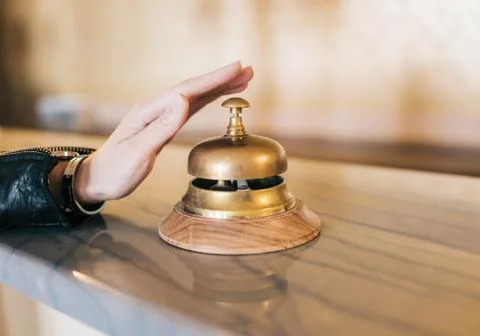 Hand ringing service bell Stock Photos