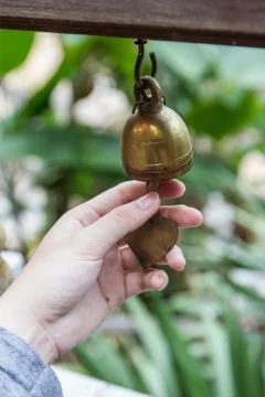 Hand ringing small thai style bell Stock-Fotos