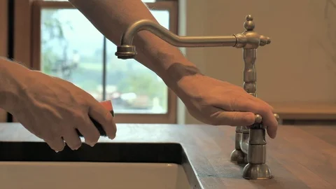 Hand rinses a sponge Stock Footage 117034177