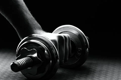 Hand rises dumbbell Stock Photos