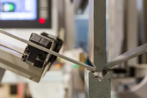 Hand robot working automatic cutting and bending metal Stock Photos
