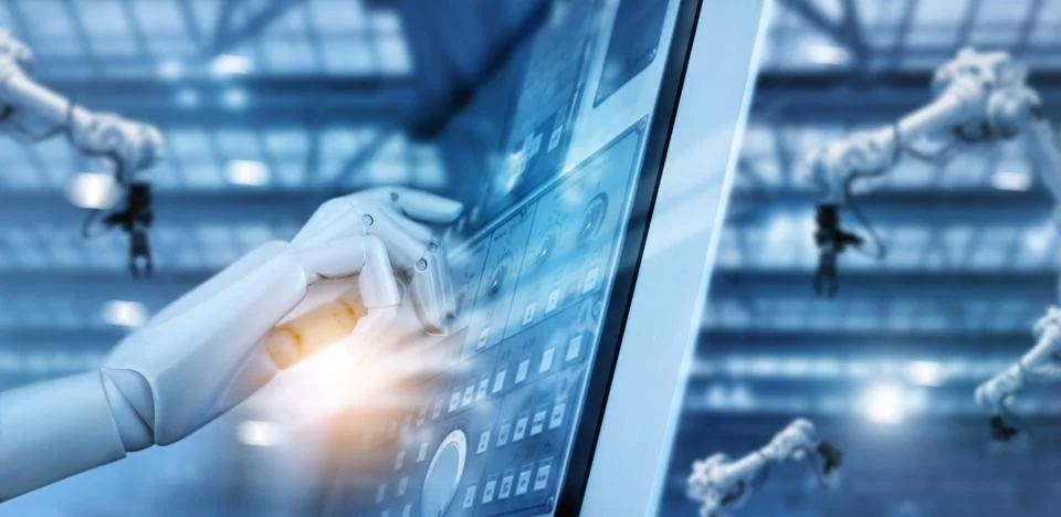 Hand of robot working on control panel in intelligent factory industrial morning Foto stock