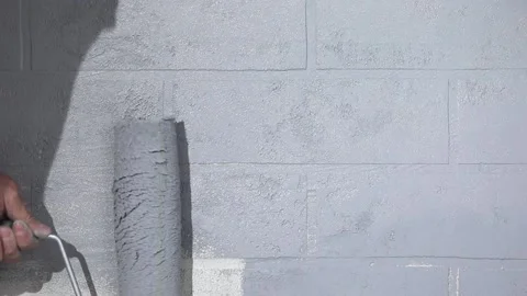Hand with a roller paints the wall 動画素材 221474021