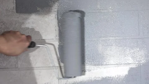 Hand with a roller paints the wall 스톡 동영상 222814657