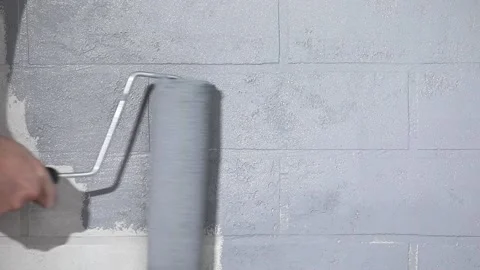 Hand with a roller paints the wall Stock-Footage 223403725