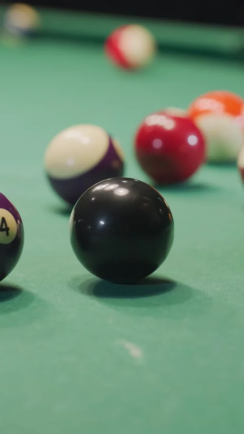 Hand Rolling Black Billiard Ball on Green Pool Table in Motion Video stock 319790640