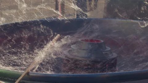 Hand rolling cotton candy in candy floss machine Stock Footage 99320557