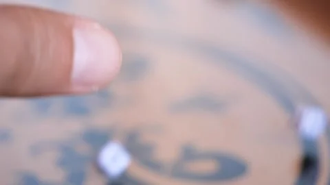 Hand is rolling the dice on the backgammon board, closeup view Vidéo 301921266