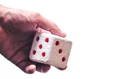 Hand &amp; Rolling Dice. Hand rolls a dices on white isolated background. Selecti Stock Photos