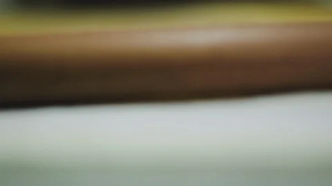 Hand rolling dough with rolling pin on counter in kitchen Stock Footage 107569088