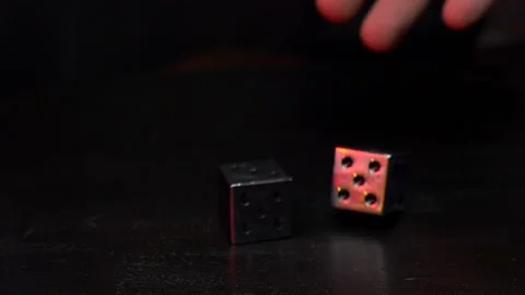 Hand rolling metal dice Stock Footage 144035730