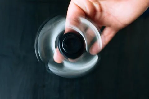 Hand with rolling spinner. Stock Photos