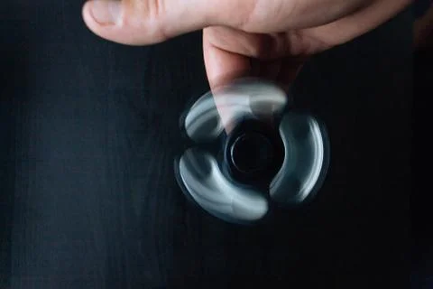Hand with rolling spinner. Stock Photos