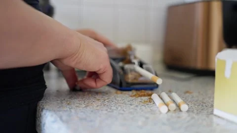 Hand Rolling Your Own Cigarettes at the Comfort of Your Home for a Personalized Stock Footage 304684749