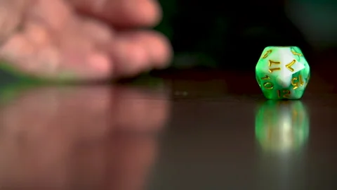 Hand rolls 20 sided dice Stock Footage 201496373