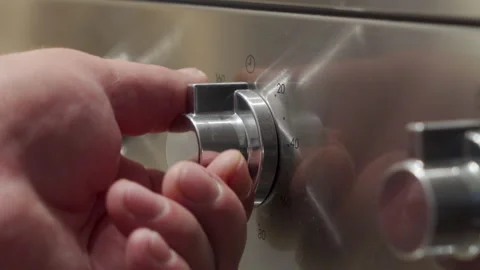 Hand Rotates Oven Timer Knob to Set Cooking Duration with Loud Click Video stock 321205045