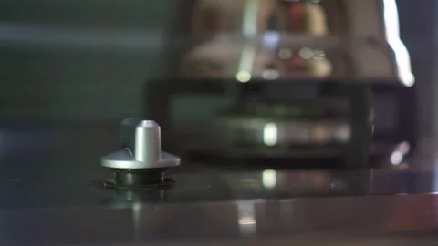 Hand rotating gas stove control knob, turn off flame for cooking. Stock Footage 342633485