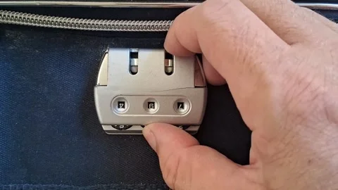 Hand rotating luggage combination lock dial for security motion footage Stock Footage 339247322