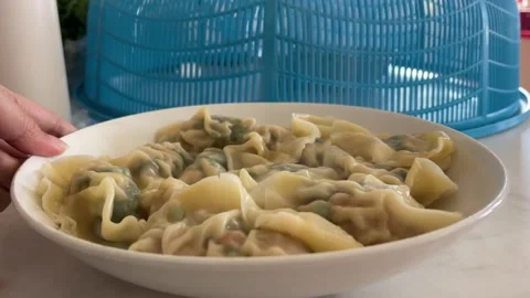 Hand Rotating Plate To Show Steaming Hot Cooked Pork Dumplings Stock Footage 330565810