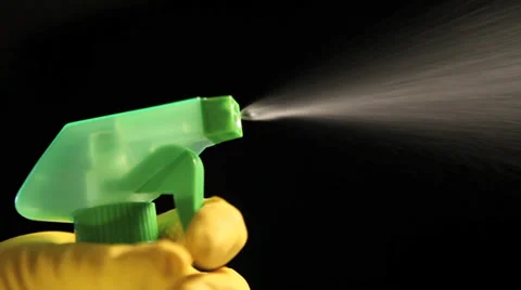 Hand in a rubber glove holding a spray bottle Stock Footage 37227053