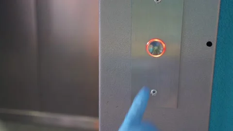 Hand in rubber glove push the elevator button. Personal protection against Stock Footage 140458154