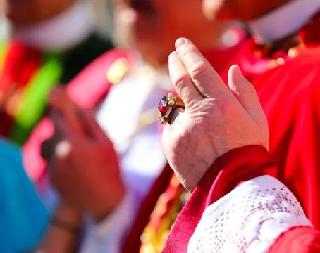 Hand with ruby ring of the cardinal dressed in red during the blessing 스톡 사진