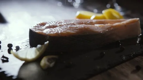Hand salts salmon steak Stock Footage 72708692