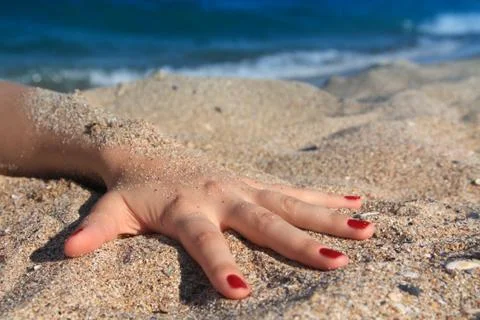 Hand in the Sand Stock Photos