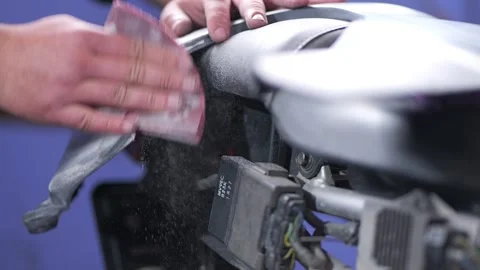 Hand Sanding Motorcycle Plastic Part with Filler on Seat Close Up Stock Footage 331675134