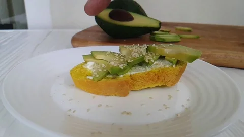 Hand sandwich with avocado Stock Footage 86855760