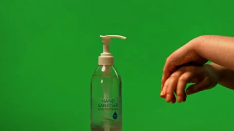 Hand sanitiser being used on green screen Pt 1 of 2 Stock Footage 149693785