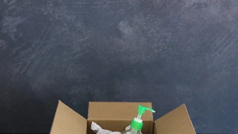 Hand sanitizer bottle inside delivery parcel symbol highly sought after produ Stock Footage 126620882