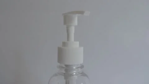 Hand sanitizer bottle in white background corona virus COVID close up tilt 1080p Video stock 139465264