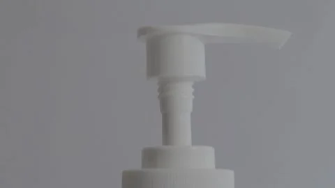 Hand sanitizer bottle in white background corona virus COVID close up tilt 1080p Stock Footage 139465644
